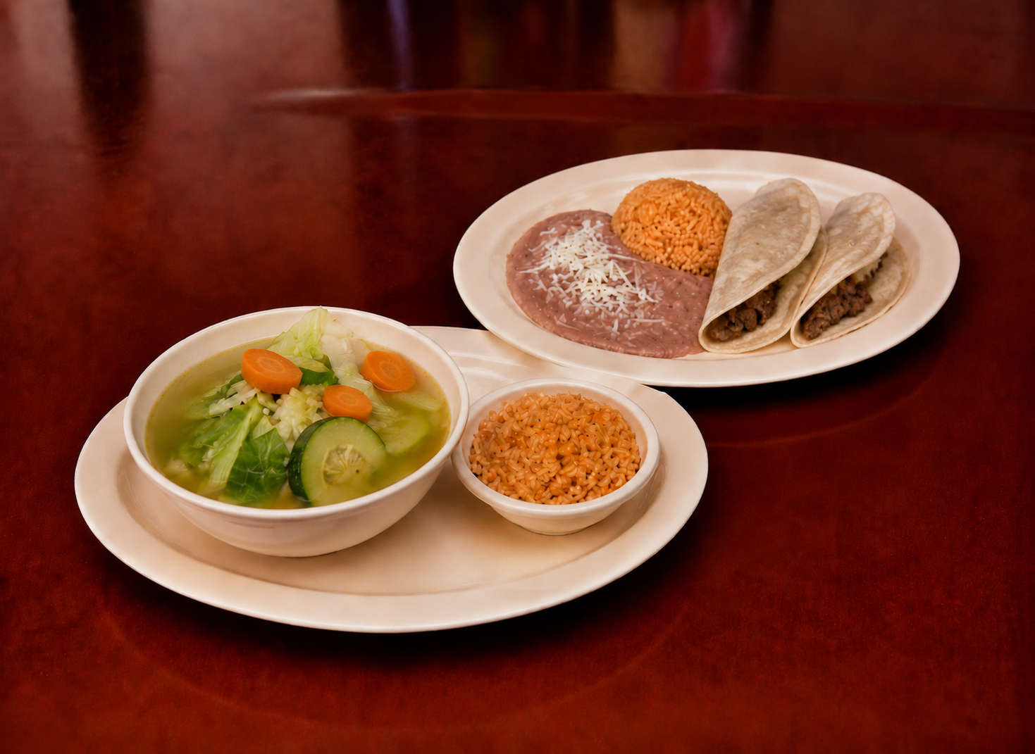 Comida corrida with caldo de rez, rice, beans and two tacos